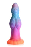 Creature Cocks Galactic Cock glow-in-the-dark alien dildo in vibrant pink, orange, blue, and purple colors with sparkling glitter texture.