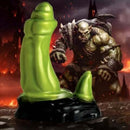 Creature Cocks Orc Silicone Dildo with Green Orc Figure in Background.