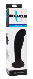 Strap U Heart-On Silicone Harness Dildo in black packaging, curved design for G-spot stimulation, phthalate-free, body-safe, firm yet flexible.