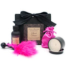 Little Black Bag Sweet Desire romantic essentials kit with powder, feather duster, massage candle, and oil from Olivia's Boudoir