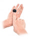 Hands holding black remote control device for Fetish Fantasy Series Date Night Remote Control Panties.