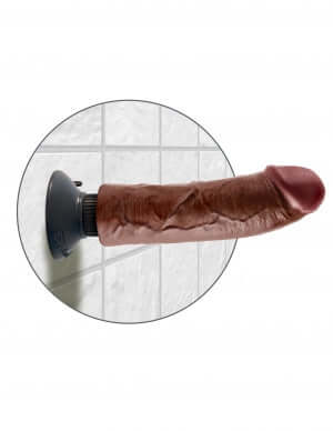 King Cock 8-inch brown vibrating dildo with posable spine on a tiled background