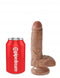 King Cock 7-inch Tan dildo with realistic details and balls next to a red Pipedream soda can for size comparison