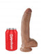 King Cock 9 inch Tan Dildo with Balls next to a red Pipedream soda can for size comparison
